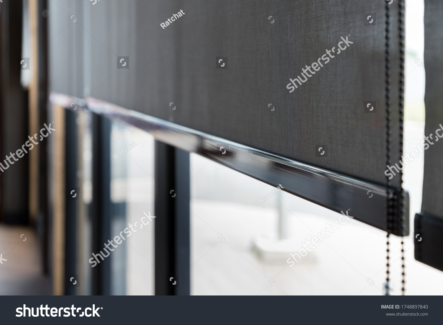 stock-photo-blind-curtain-or-black-blinds-roller-sun-protection-in-office-1748897840